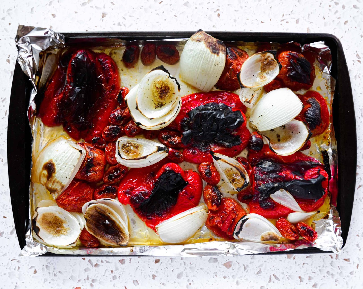 step 5 Once you take the vegetables out of the oven, place the red peppers in a bowl and cover with a lid or place them into a ziplock bag and close. Leave for 10 minutes to steam.