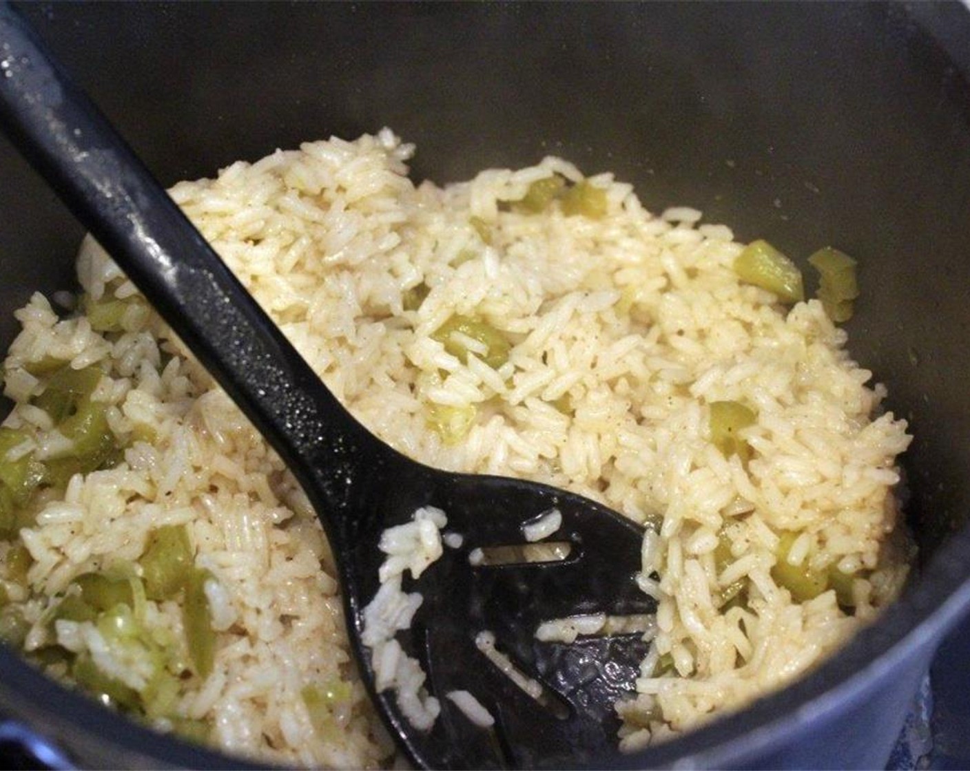 step 8 Then, cover the rice and cook using the directions provided until the rice is just cooked.