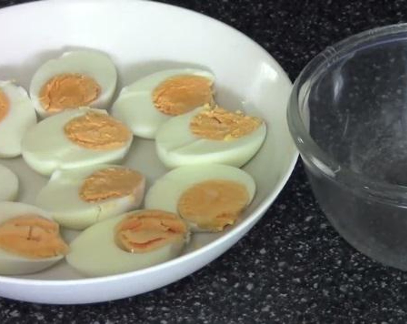 step 1 Cut the Eggs (6) in half, and scoop out the yolk from each into a bowl. Mash up all the yolks in the bowl.