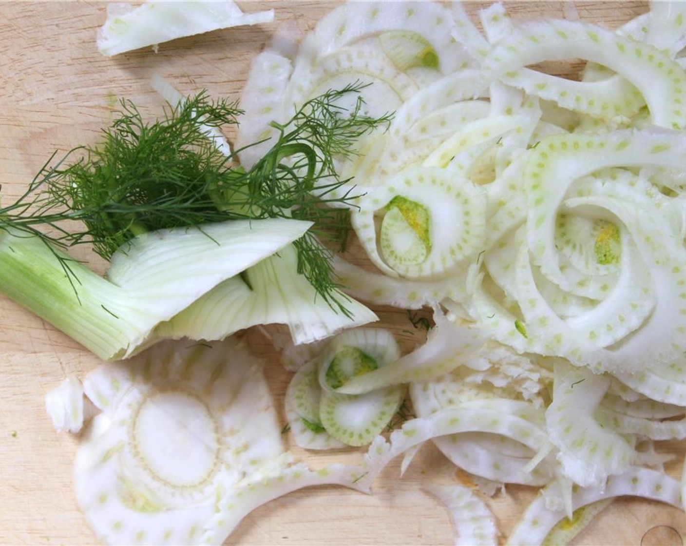 step 2 Meanwhile, remove the stalks from the Fennel Bulb (1). Shave the fennel bulb to the thickness you prefer-1/8 inch thickness or less for a delicate salad. Reserve the fennel leaves.