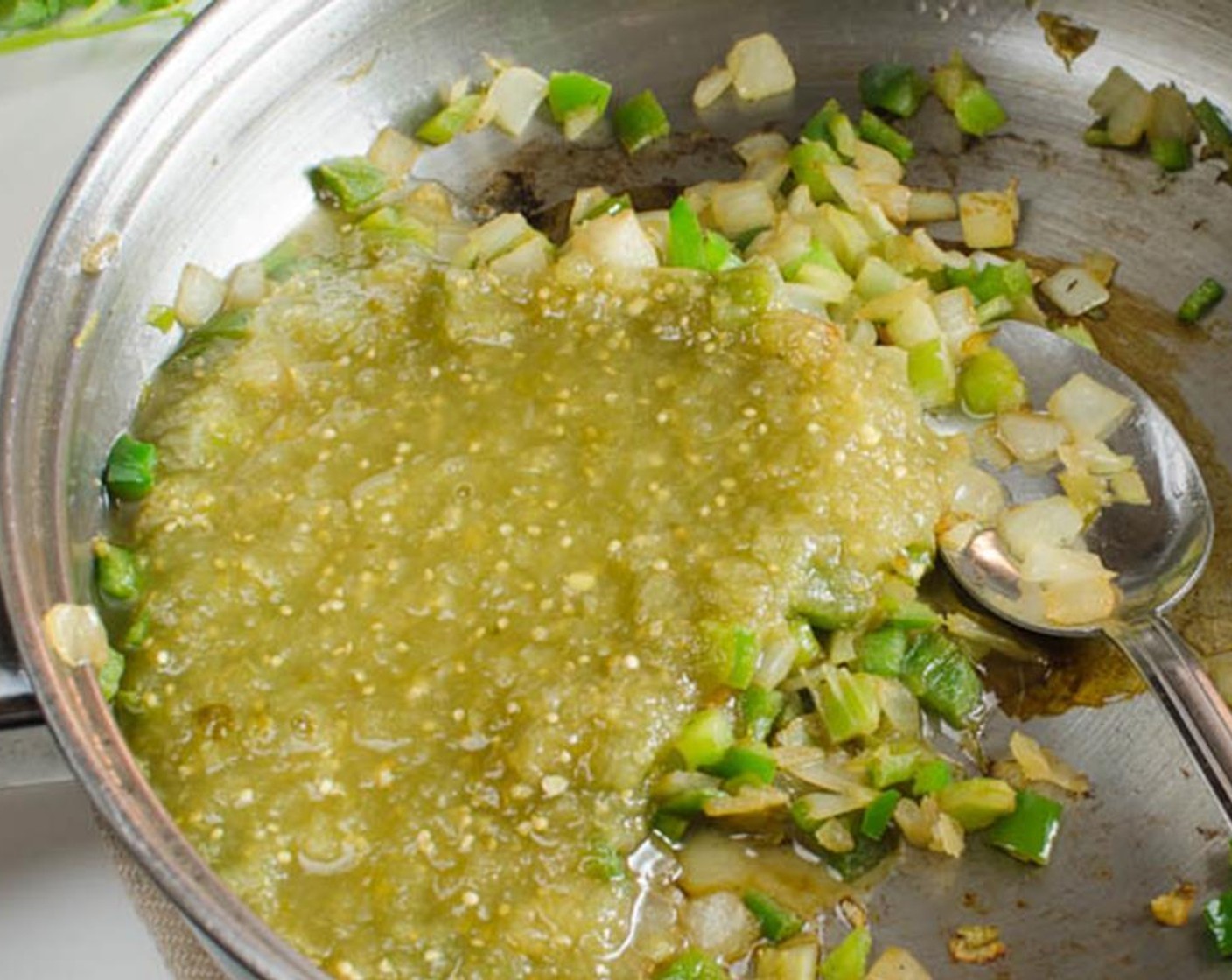 step 7 Meanwhile, in a small pot over medium heat, add the remaining Olive Oil (1 Tbsp) and the remaining half of the onion, bell peppers, and celery. Sauté until tender and slightly translucent.