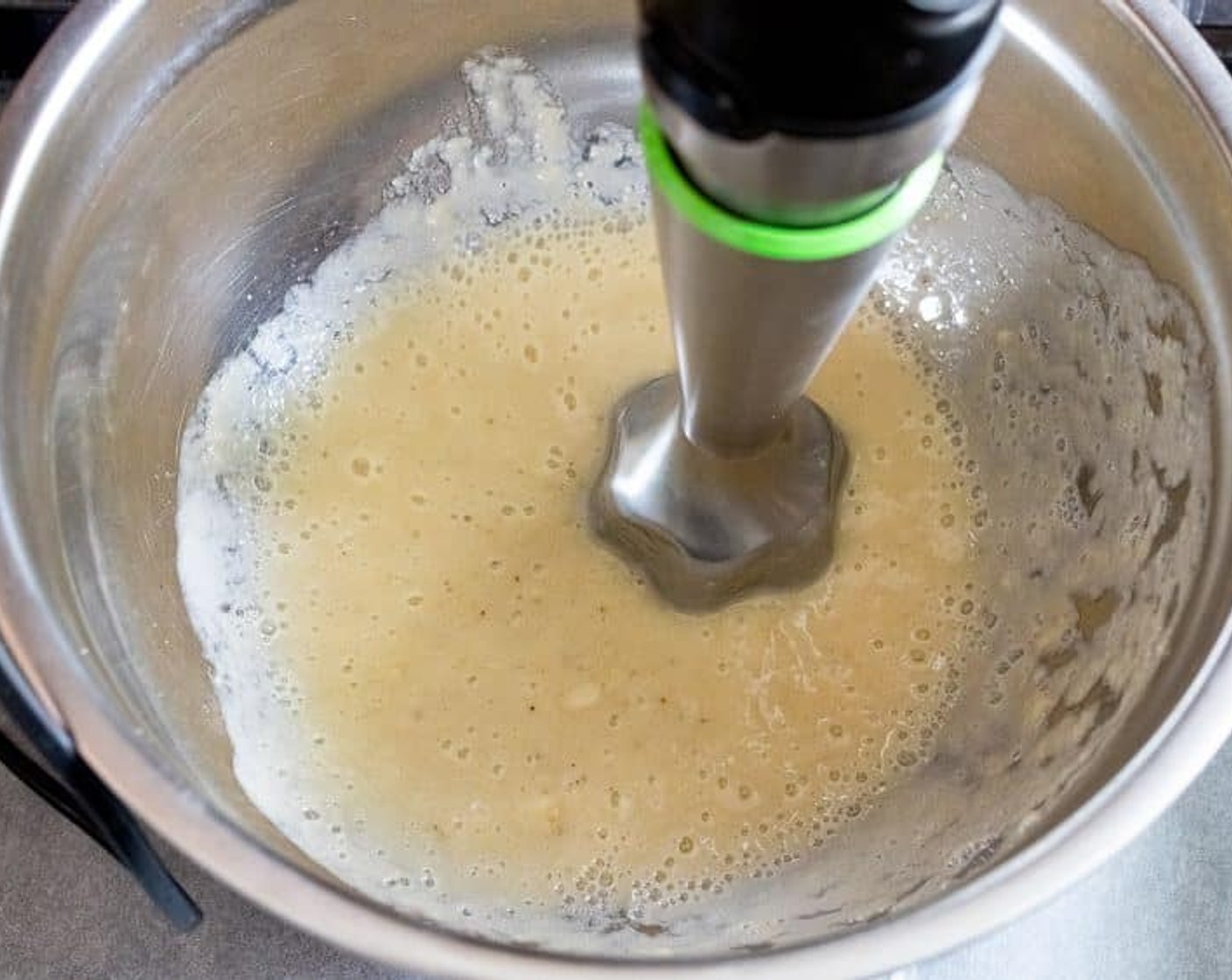 step 2 Peel Bananas (2) and mash them with a fork or a hand blender in a large mixing bowl.