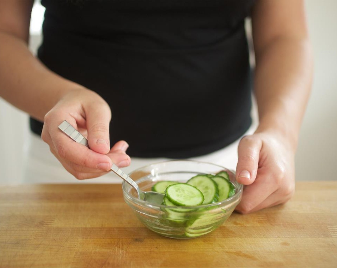 step 2 Slice Small Cucumber (1) on an angle into 1/4 inch thick slices and toss into pickling liquid; allow to pickle until plating.