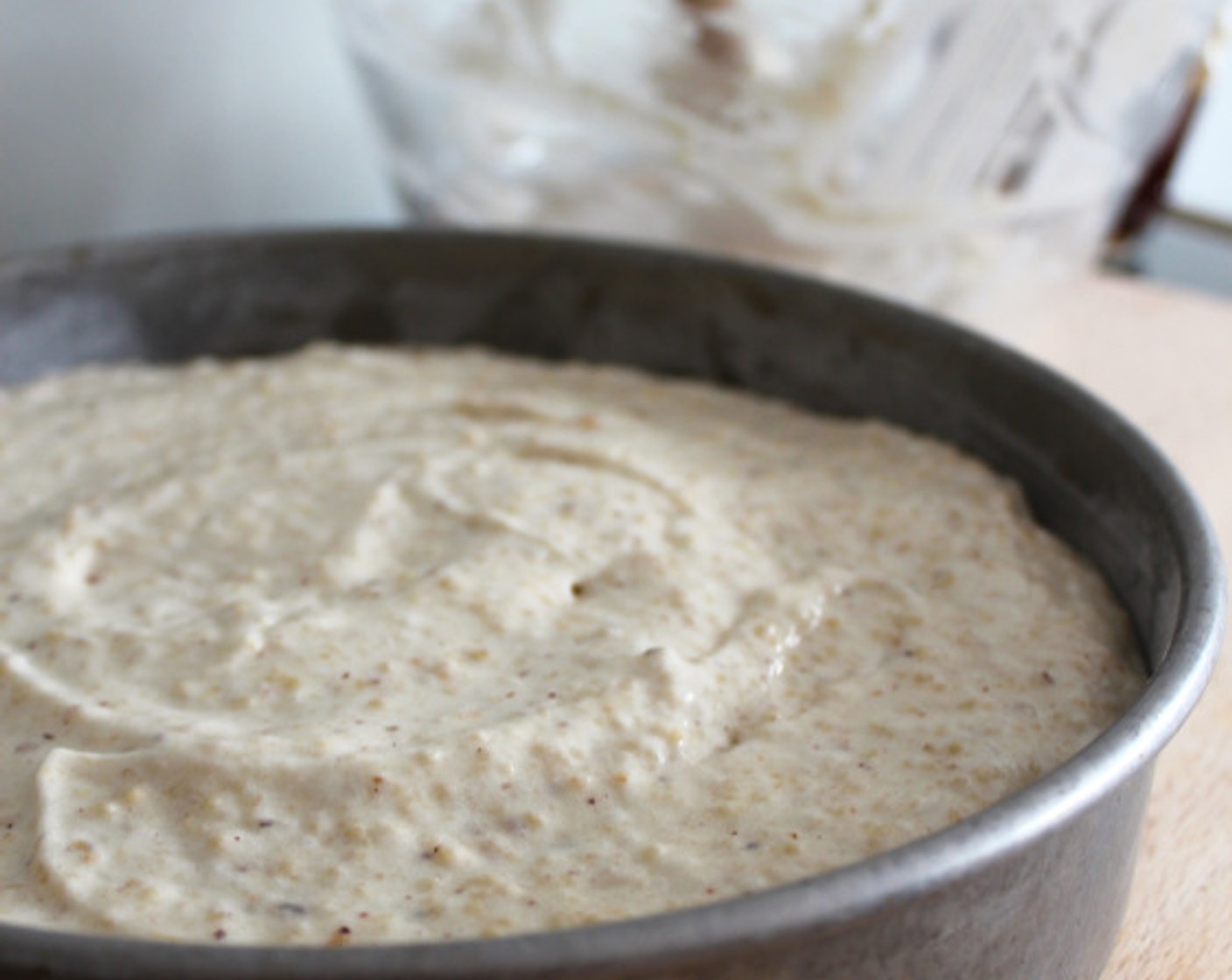 step 7 Using a rubber spatula, very gently fold in the browned butter, then the nut/flour mixture, until just combined. Transfer the batter to the pan, and smooth the top with a rubber spatula.