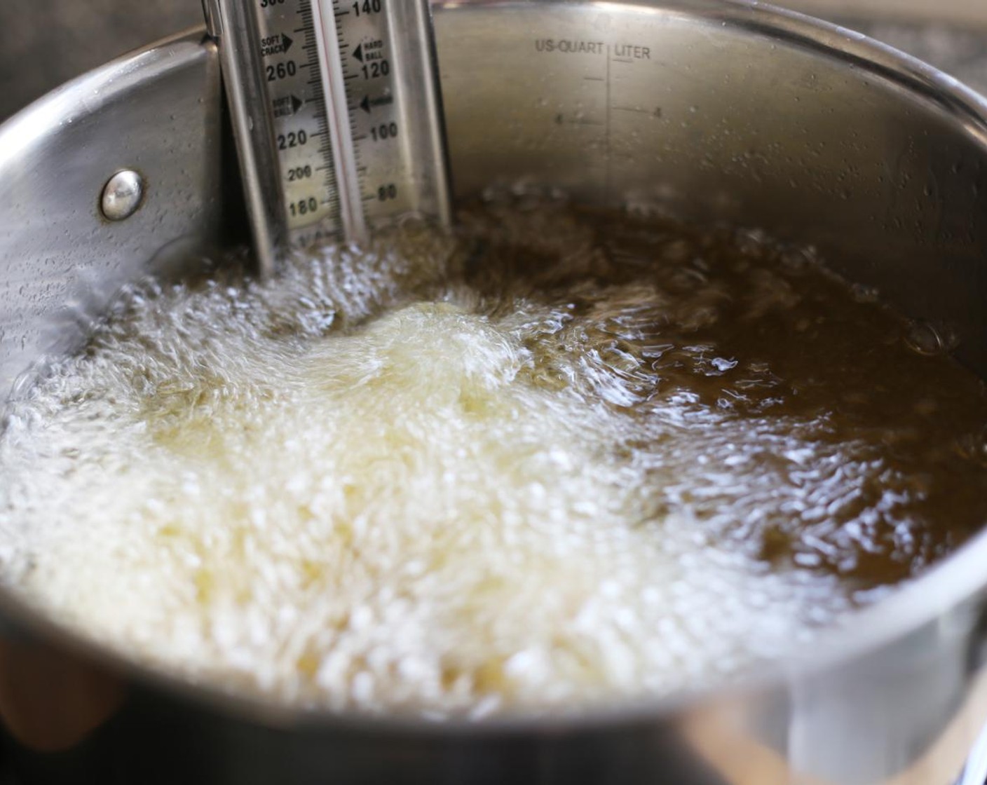 step 11 Working in batches of three, carefully add the coated tenderloins and deep fry until cooked through, around 4 minutes.