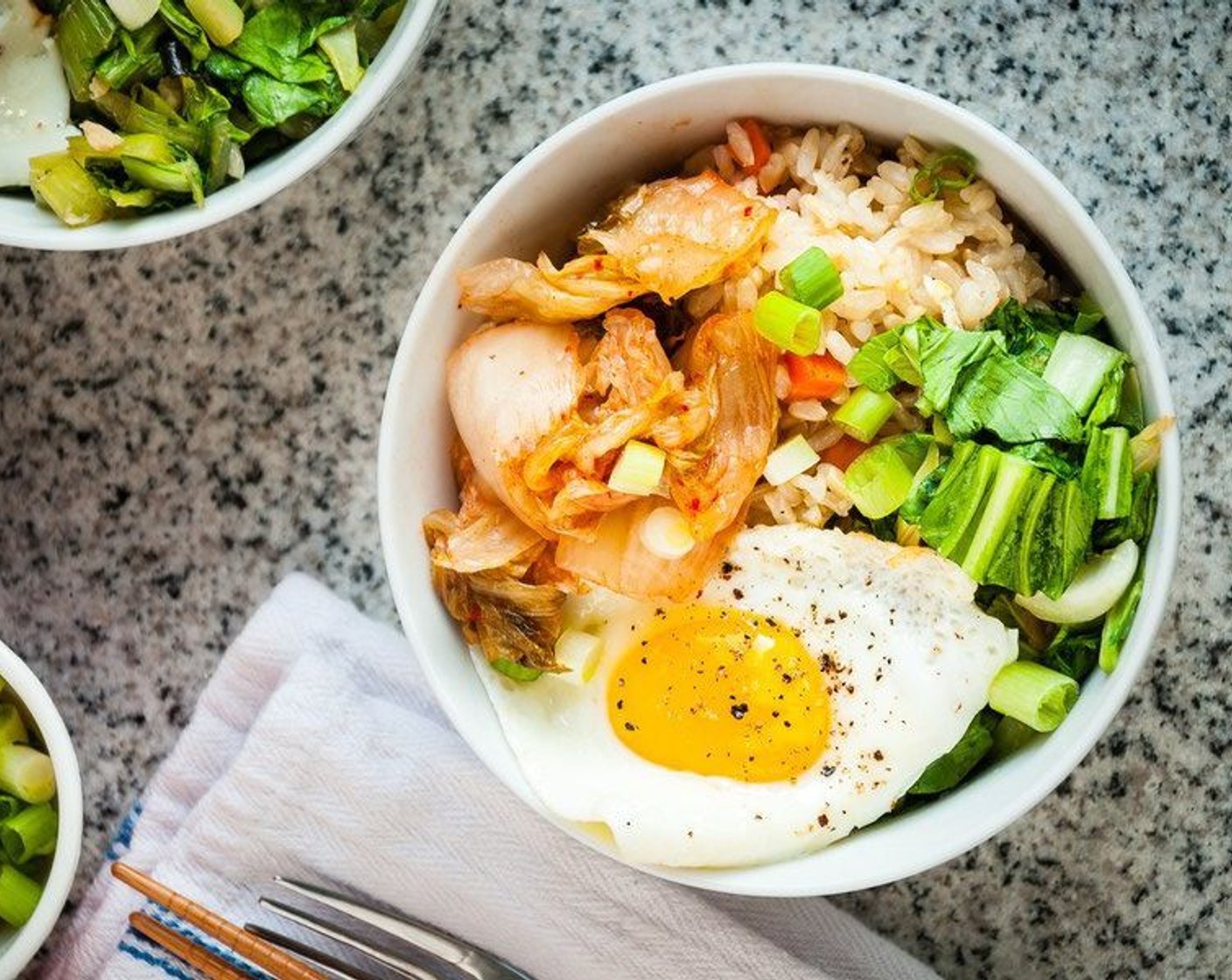 step 11 Divide rice among bowls. Top each bowl with bok choy mixture, egg, sliced scallions, and a large spoonful of Kimchi (to taste). Enjoy!