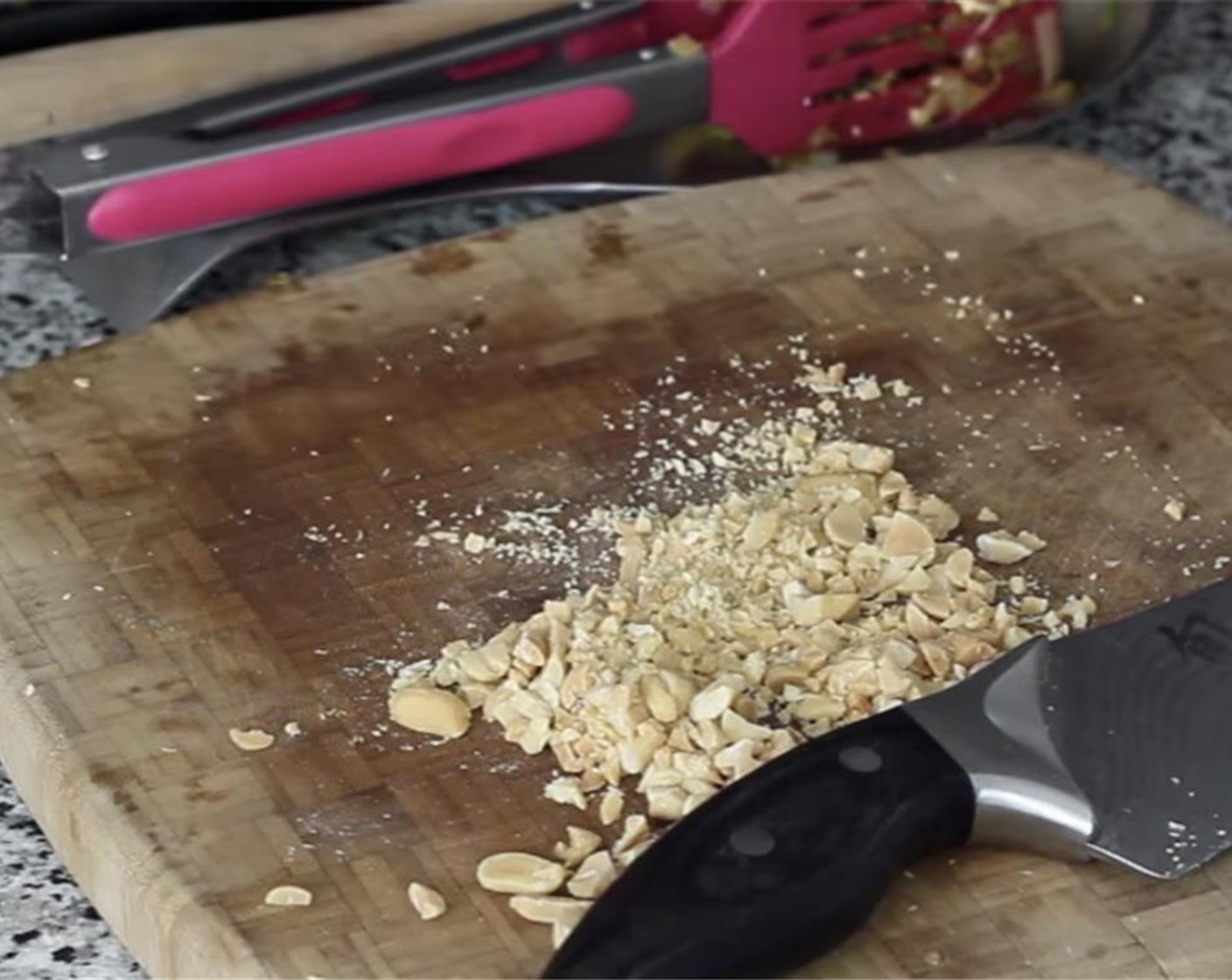 step 19 Roughly chop some Dry Roasted Peanuts (1/4 cup) and add to the pan. Set some aside for the garnish. Toss carefully then plate.