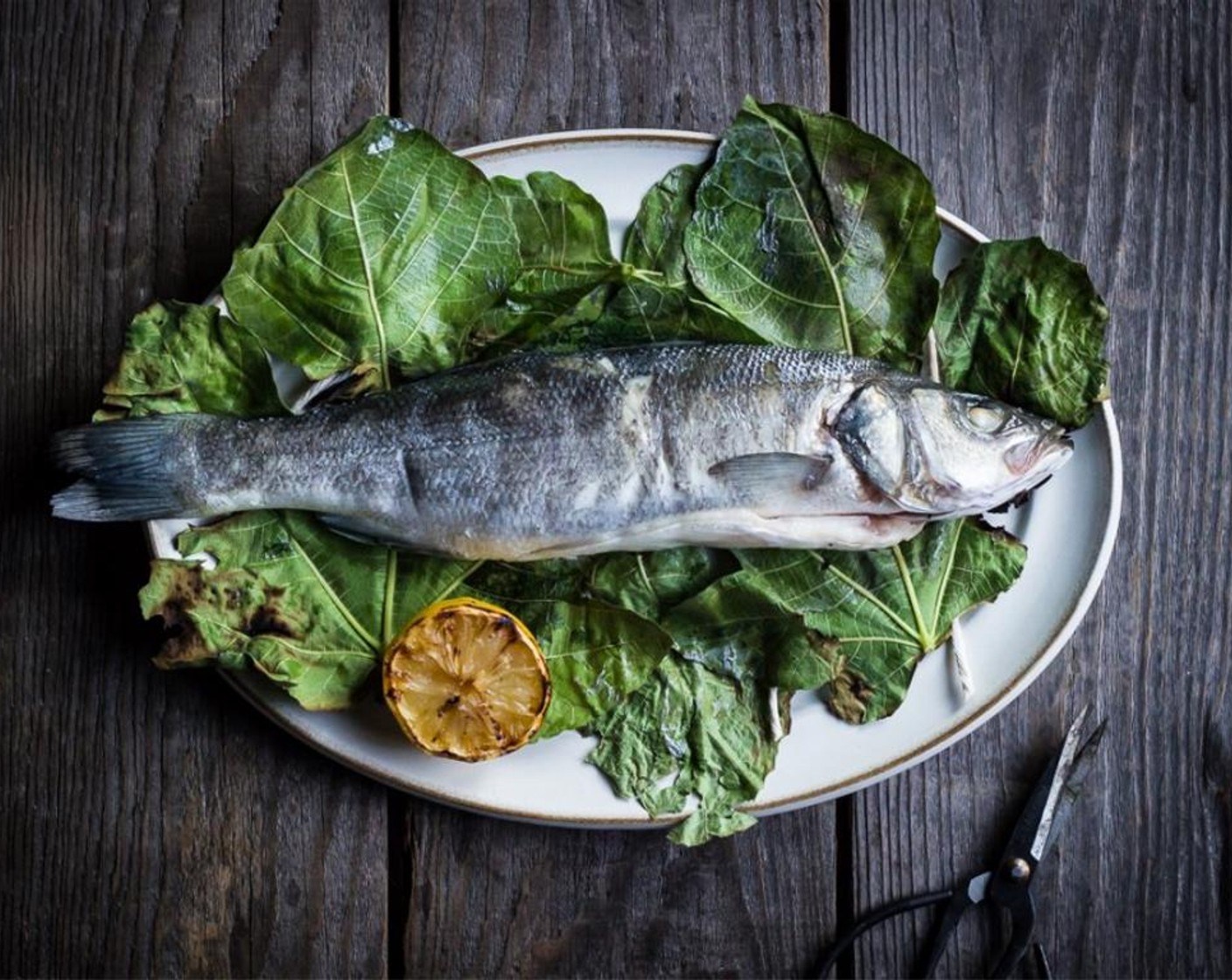 step 11 Remove fish and lemon halves from the grill and serve each fish with a lemon half. Serve and enjoy.