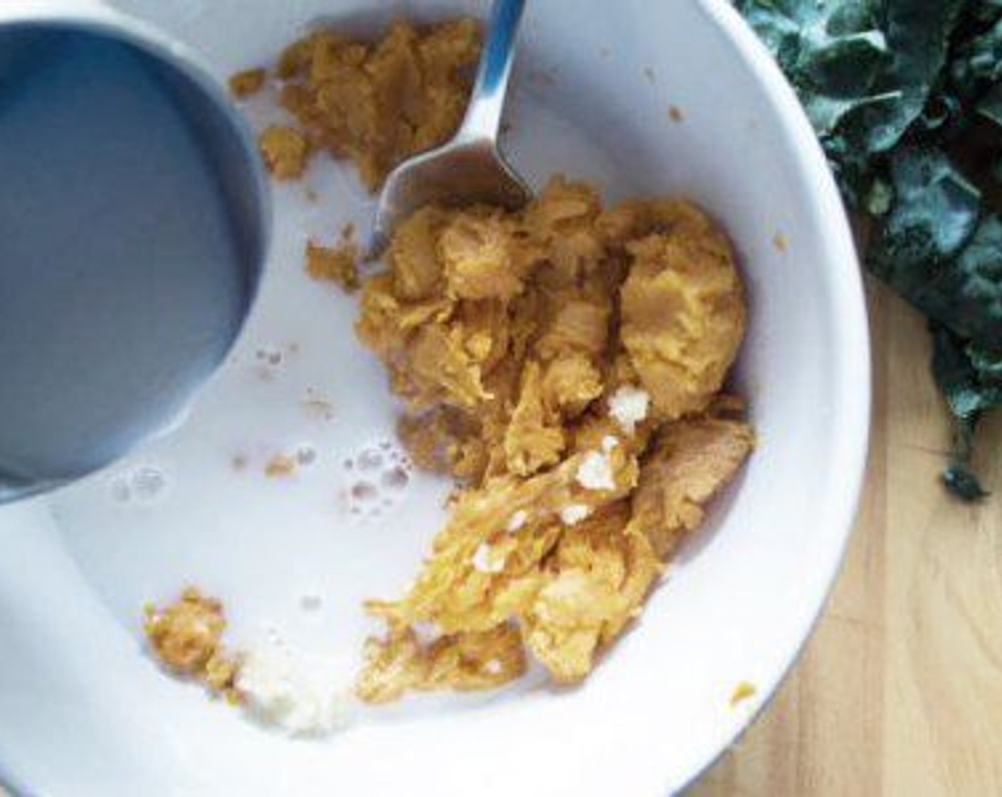 step 7 Add Almond Milk (1/2 cup) and Garlic (1 clove) and stir until creamy.