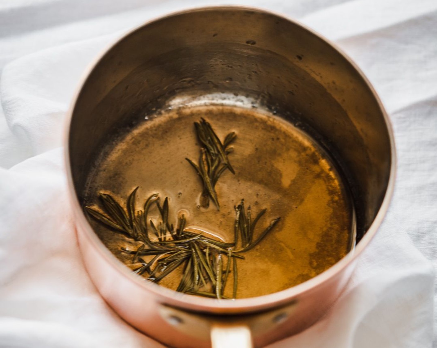 step 1 Add White Wine Vinegar (1/2 cup), Honey (1/4 cup), and Fresh Rosemary (1 sprig) to a small saucepan and whisk to combine