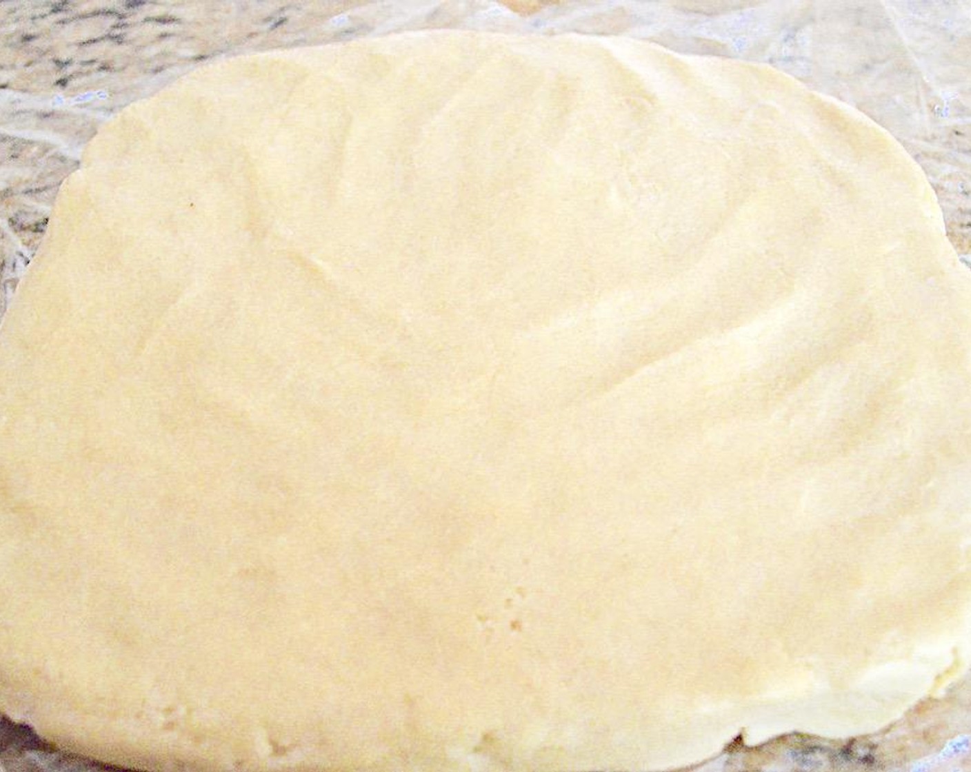 step 5 Wash out the bowl you used to make the levain, or get out a fresh bowl and grease it well with Butter (2 Tbsp). Transfer the dough to the buttered bowl and cover it with plastic wrap. Set it aside to rise for an hour, until doubled in size. Punch it down, cover it in plastic again and put it in the refrigerator for another hour.