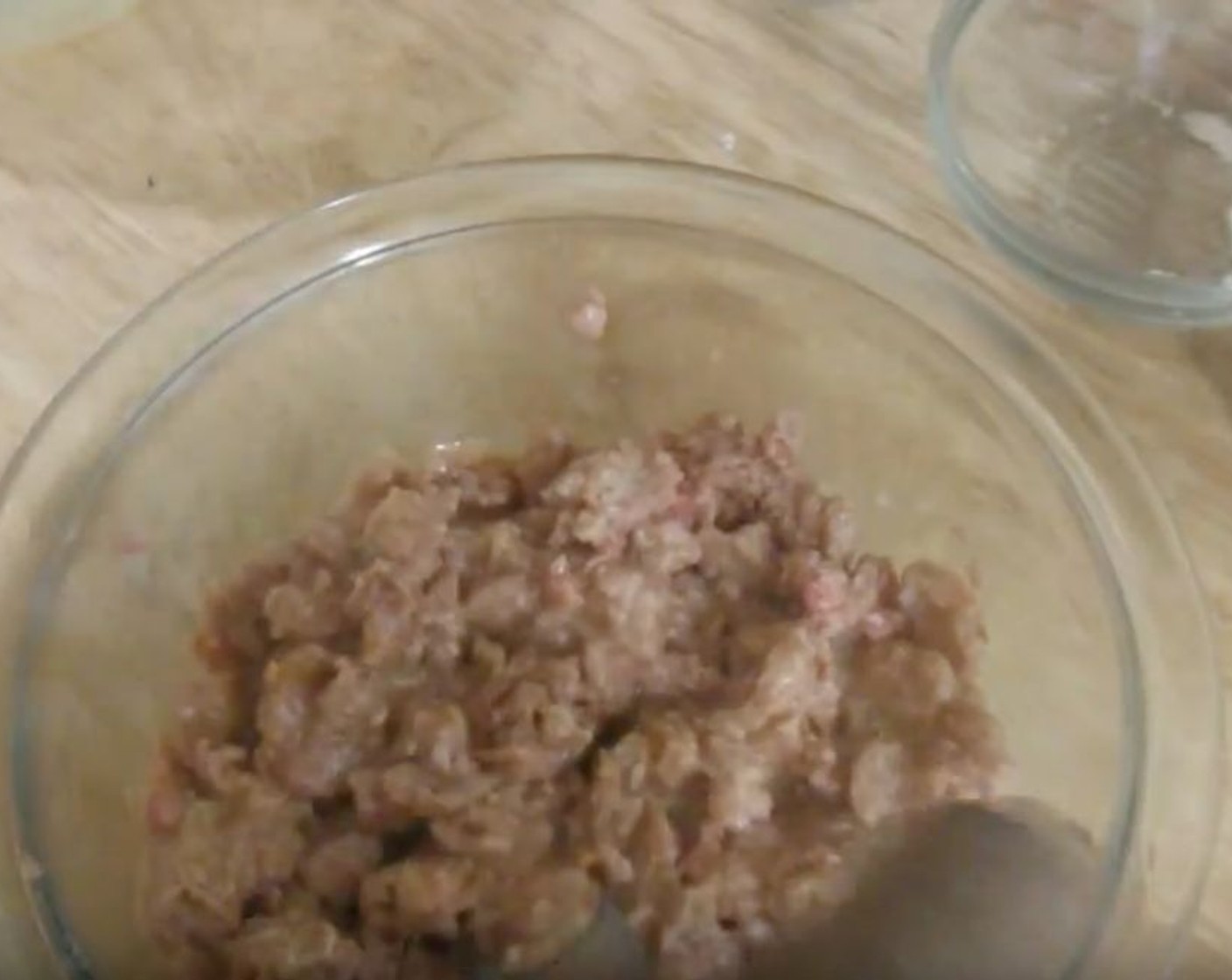 step 3 Into a mixing bowl, add Ground Beef (8 oz) and Egg (1). Mix well.