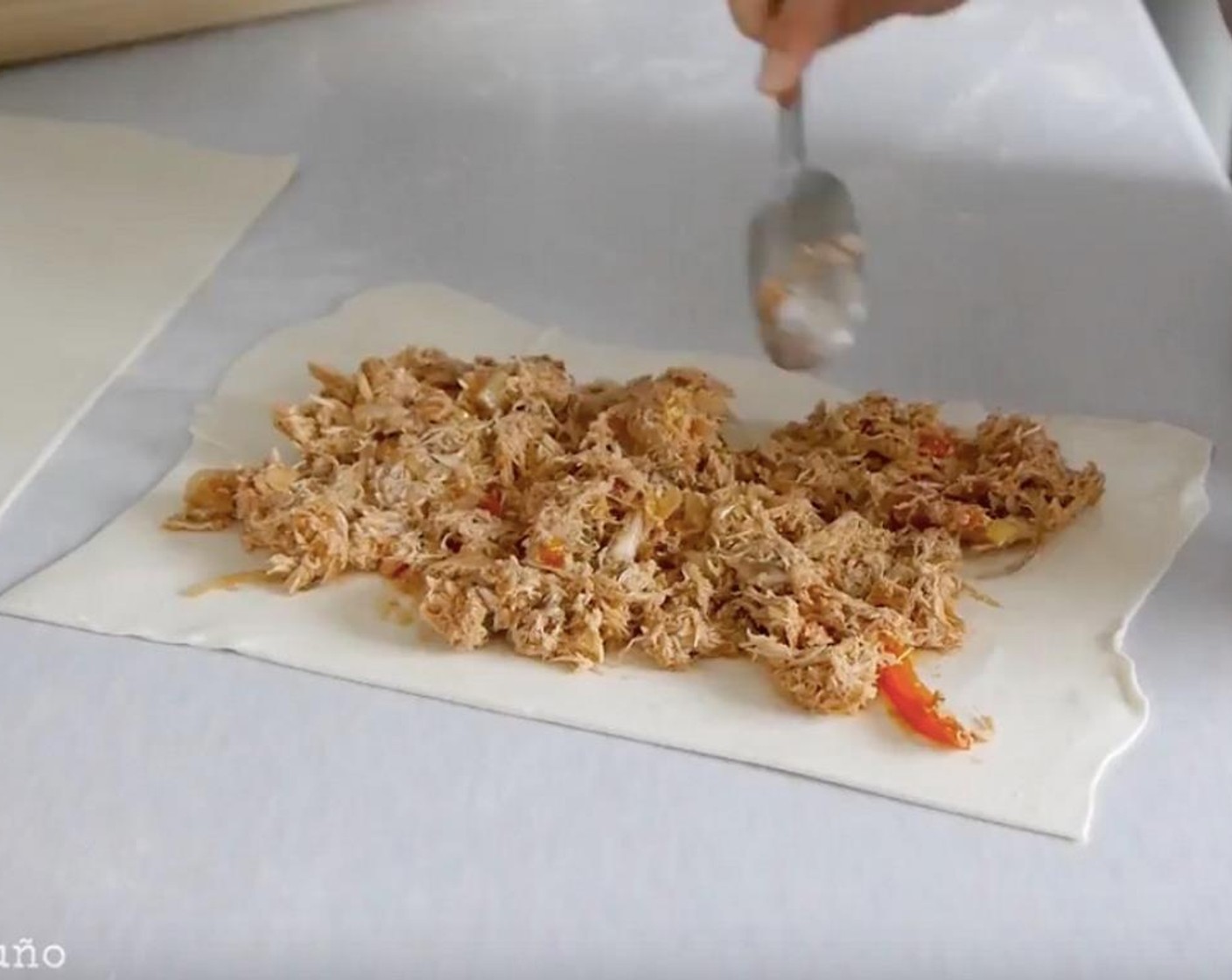 step 8 Next, spread the chicken and vegetables evenly over the sheet of dough.