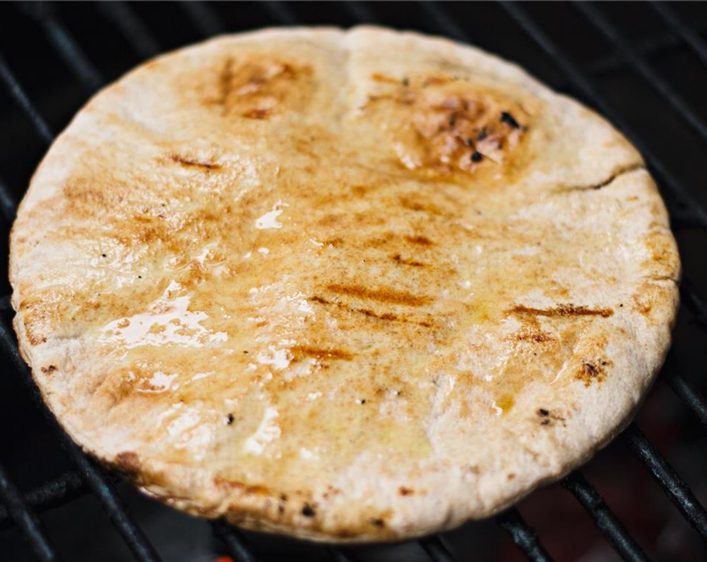 step 8 Brush the Pocketless Pita Bread (8) with Olive Oil (as needed) and throw them on the grill or in a toaster oven to lightly toast.