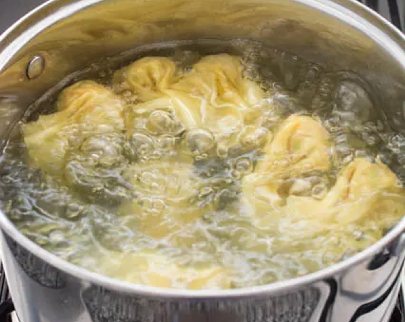 step 4 Bring a medium-sized pot of water to a boil over high heat. Cook the wontons in small batches. You’ll know when they’re cooked when they float to the top.
