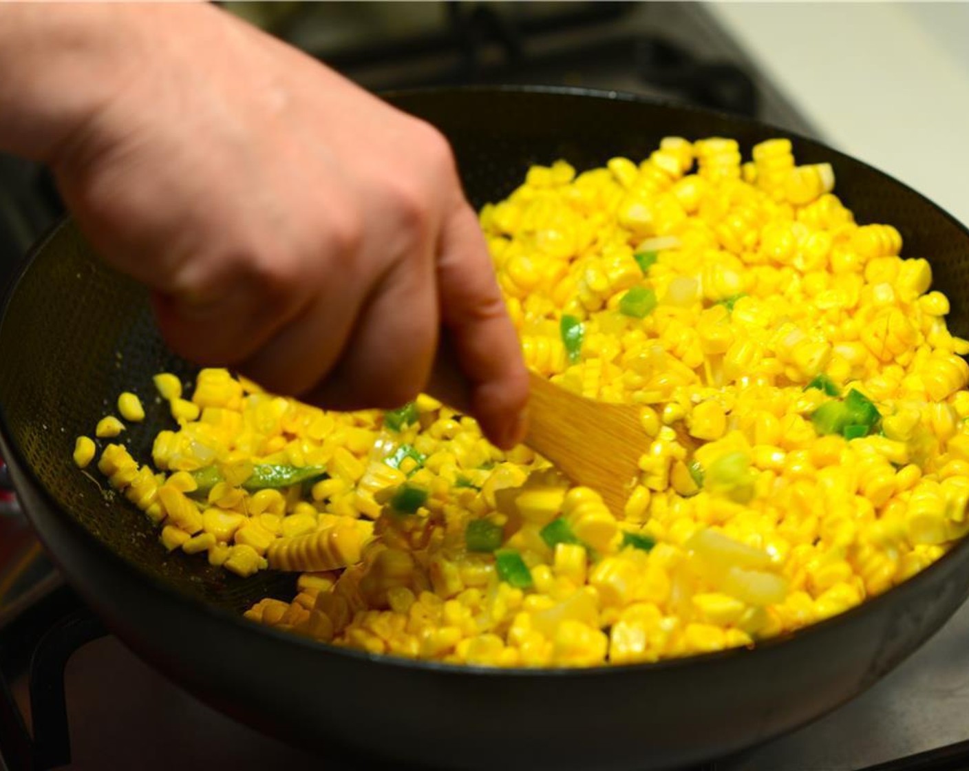 step 3 Add Corn (4 cups), the Green Bell Pepper (1/2 cup), and Jalapeño Pepper (1 Tbsp). Sauté until corn begins to soften, about 10 minutes.