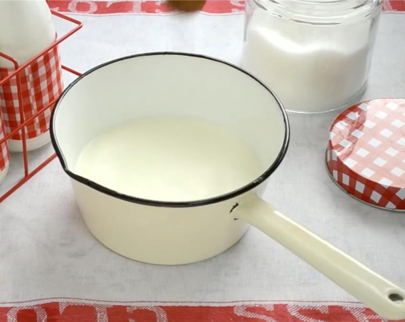 step 3 In a pot, place 3 cups of the Milk (4 cups) and Granulated Sugar (4 Tbsp) over medium heat.