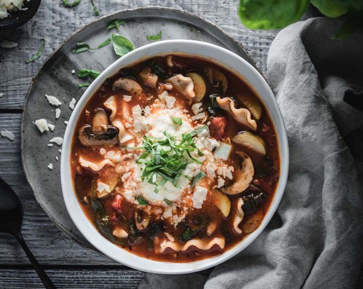 step 6 Ladle soup into bowls, add a handful of Mozzarella Cheese (4 cups), a generous scoop of Ricotta Cheese (2 cups) and a sprinkle of Parmesan Cheese (to taste) and Fresh Basil (to taste).