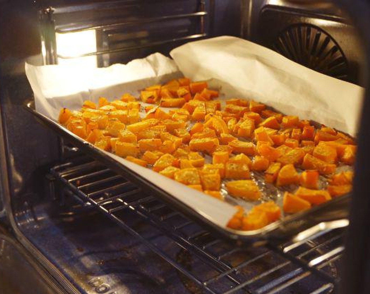 step 2 Spread Butternut Squash (3/4 cup) evenly over a parchment covered baking sheet, drizzle with Extra-Virgin Olive Oil (1 Tbsp) and bake until tender for 30-40 minutes.