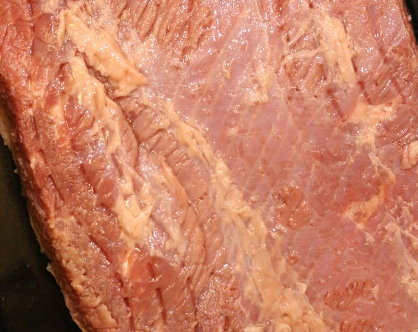 step 1 If prepping the night before, use a sharp knife to carefully trim off the excess fat on the Corned Beef Brisket (1).  Rinse beef under cold water.  Place in a large container and cover with Ginger Ale (8 1/3 cups).  Seal tightly and refrigerate overnight.