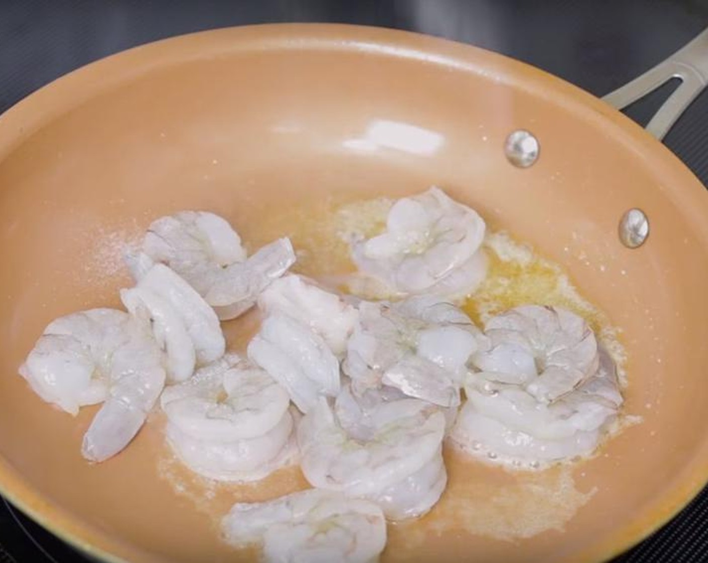 step 1 To a large non-stick skillet or wok, add the Butter (2 Tbsp) allow to melt. Add Shrimp (1 lb), season with Salt (to taste) and Ground Black Pepper (to taste), and cook over medium-high heat for about three minutes. Remove shrimps and set aside.