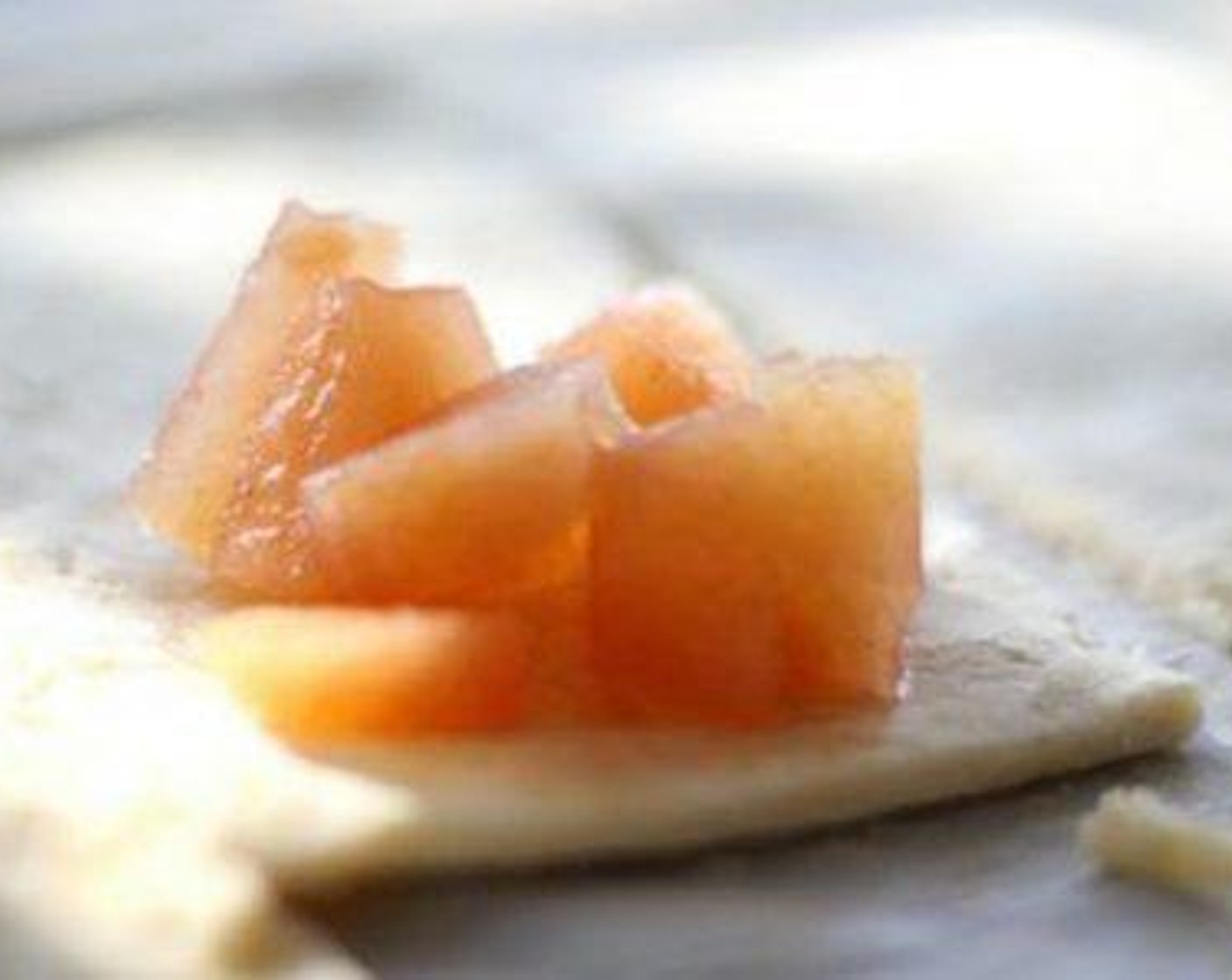 step 6 On one side of each rectangle, spoon about 2 tablespoons of Canned Fried Apples (2 cans). Fold the dough over, press the edges together, and crimp with a fork to seal.