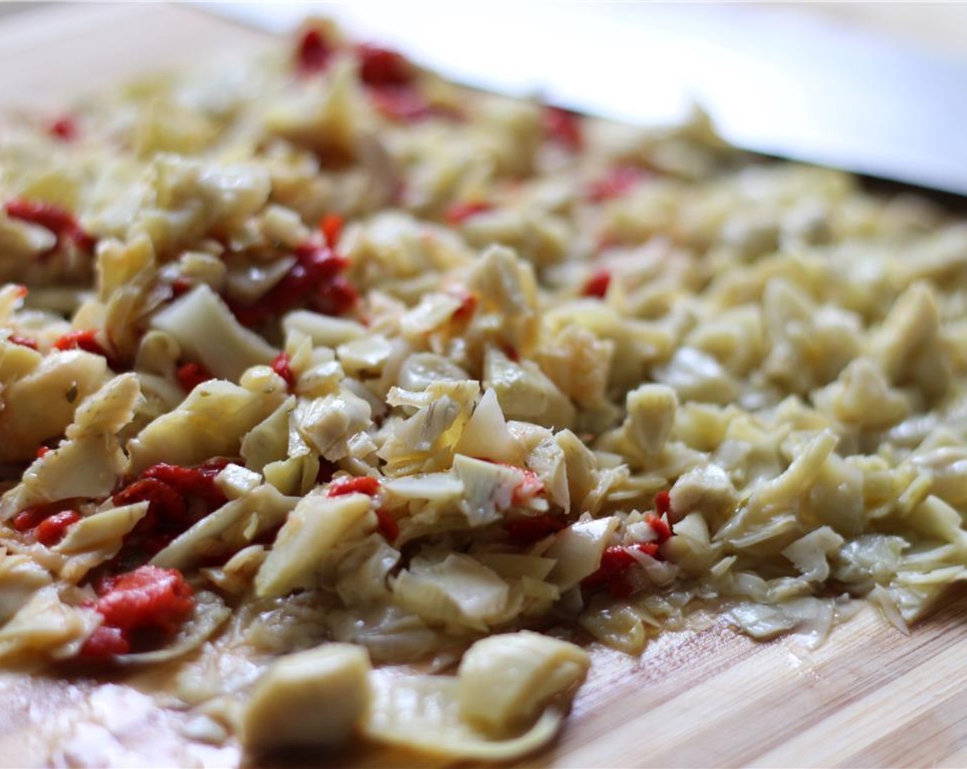 step 1 Finely chop the Marinated Artichokes (1/4 cup).