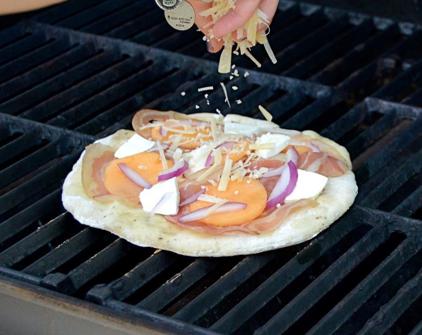 step 17 Lay one quarter of the pancetta over the dough in an even layer. Top with a quarter of the cantaloupe, mozzarella, onions and parmesan cheese.