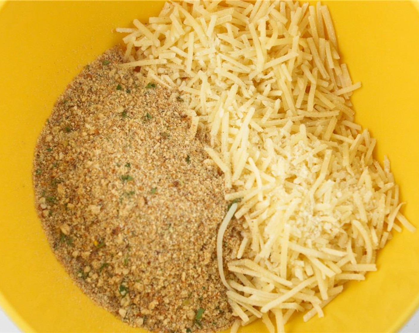 step 4 In a separate small bowl, combine the Seasoned Breadcrumbs (1/2 cup) and Shredded Parmesan Cheese (1/2 cup). Mix well.