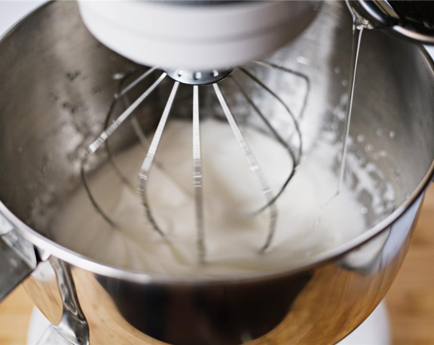 step 19 Slowly add in sugar syrup while the mixer remains on medium speed.