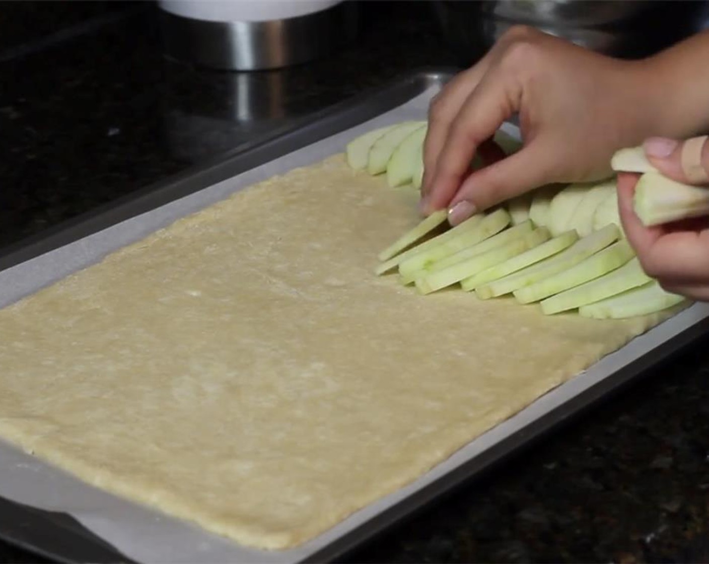 step 11 Place overlapping slices of apples on the crust any way you want until it is completely covered with apple slices, even all the way to the edges, since the apples will shrink in the oven.
