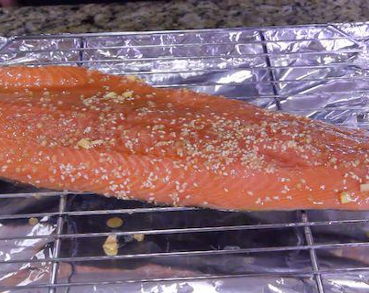 step 2 Remove salmon with kitchen tongs and place directly on a foil-lined wire rack. Sprinkle with a little bit of salt and pepper, then place directly under the broiler. Cook for 10-12 minutes depending on the salmon’s thickness, until flesh is opaque and easily breaks apart with a fork. Halfway through, brush the salmon with Honey (4 Tbsp).