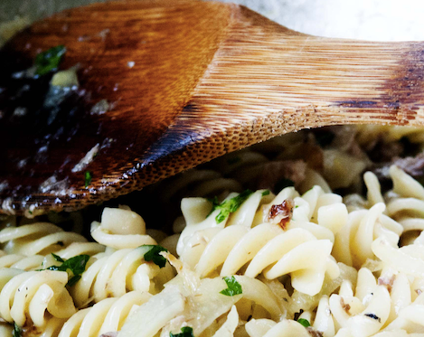 step 7 Add pasta into the pan with a few tablespoons of the cooking water, stir.