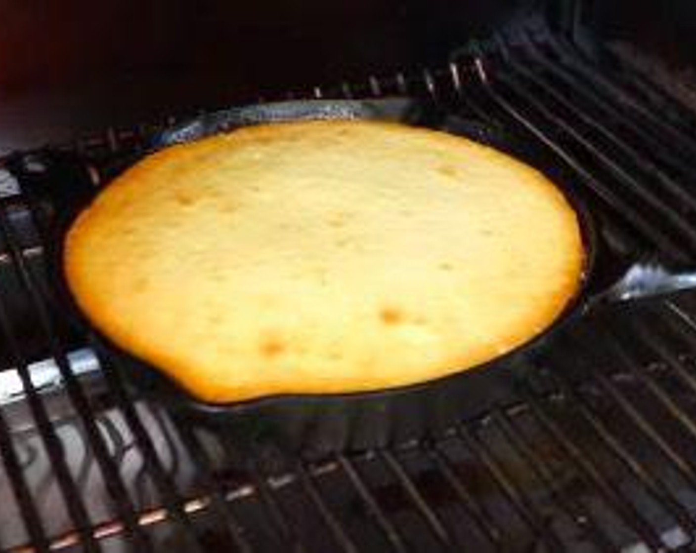 step 6 Pour cake batter into the iron skillet and place in the smoker. Cook for 45 minutes to 1 hour or until a toothpick inserted into center comes out clean.