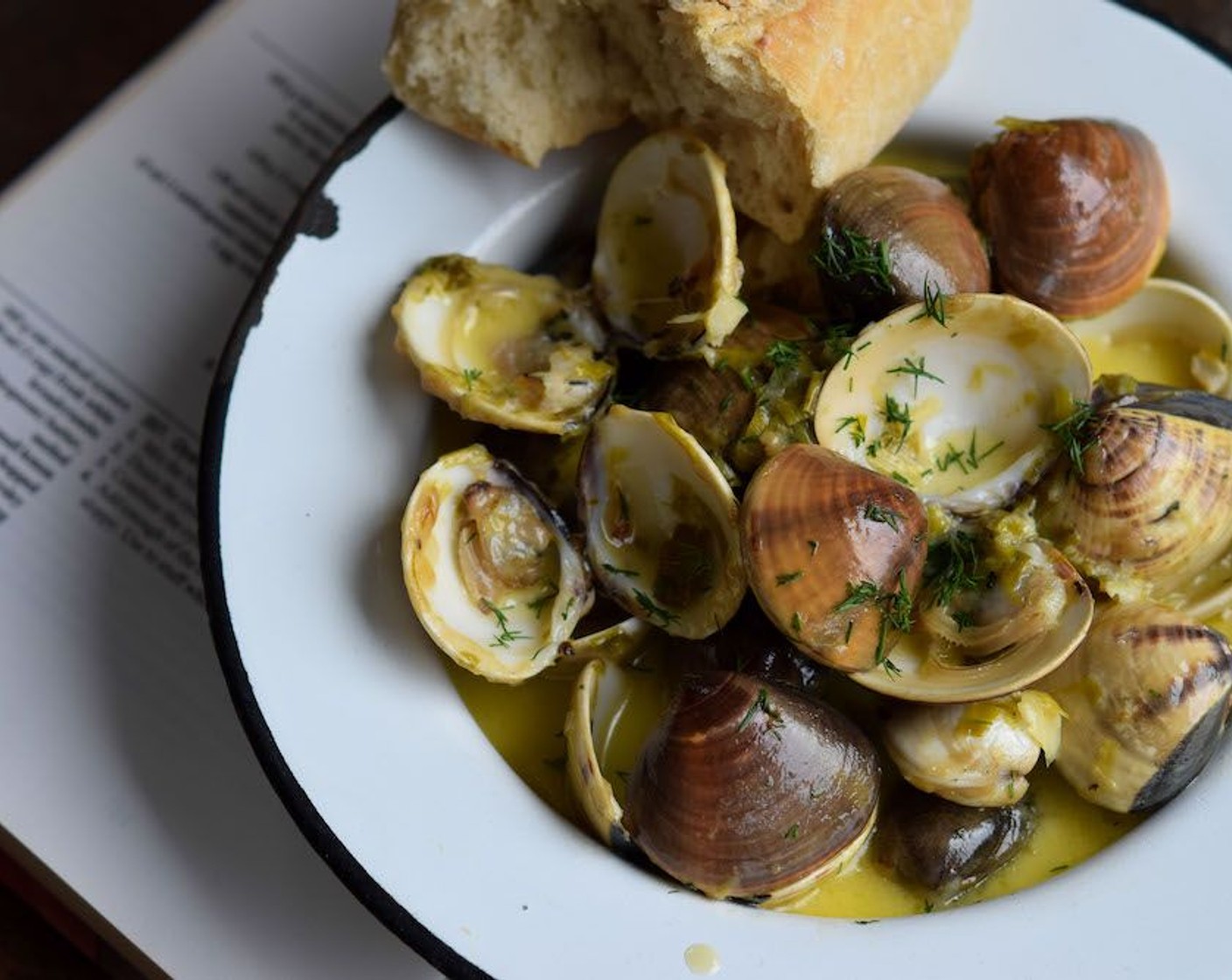 step 5 Scatter a few fronds of Fresh Dill (to taste) over the top of the dish, drizzle with a little Olive Oil (to taste) and serve the clams immediately with lemon wedges and fresh bread.