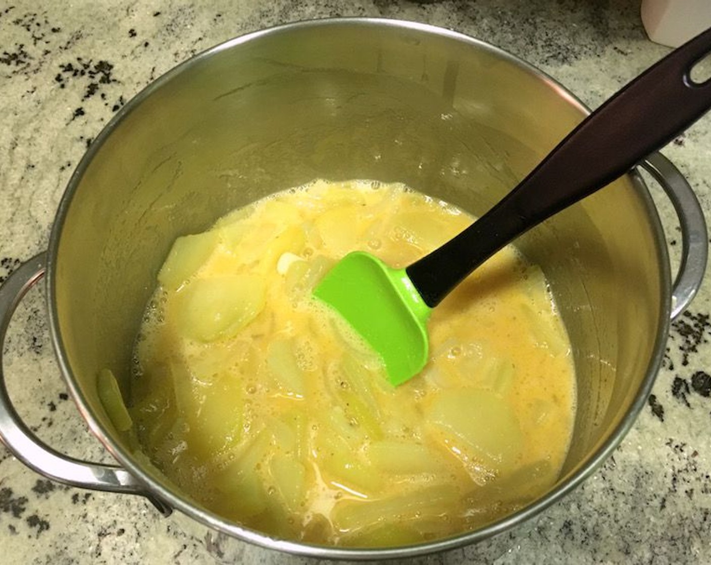 step 11 When vegetables are cool, add the onions, garlic, and potatoes to the egg mixture and stir gently with a spatula until combined.