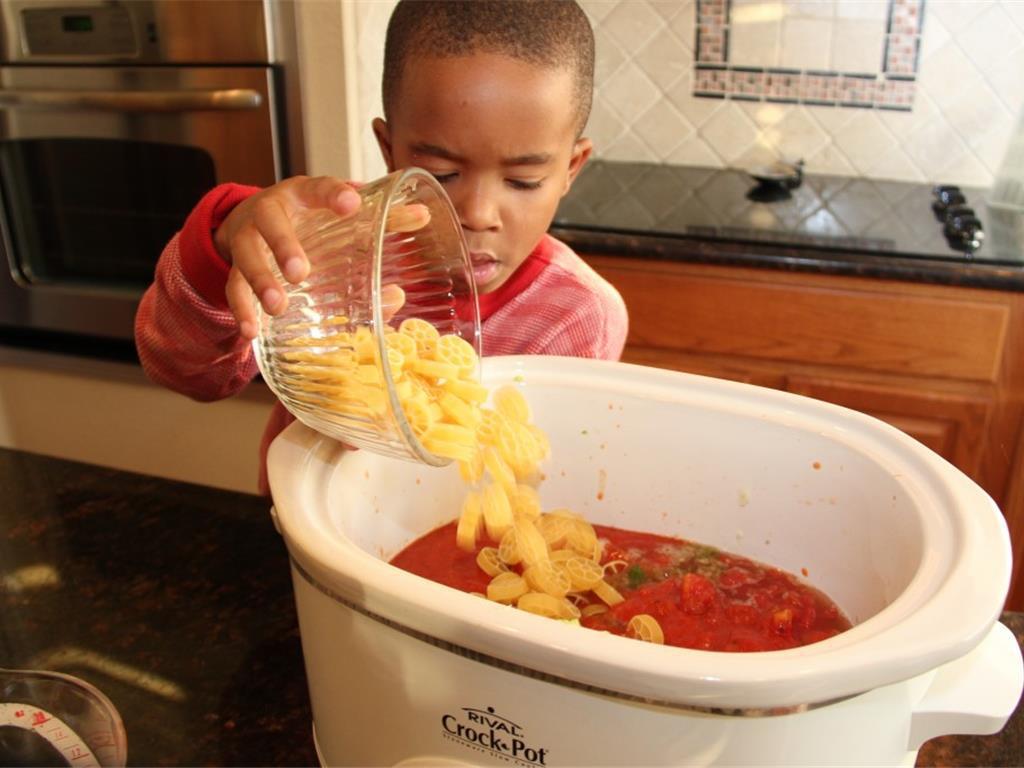 Step 5 of Pizza in a Bowl Recipe: Add the Wagon Wheel Pasta (1 cup).