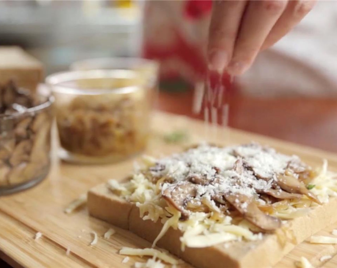 step 6 Finish by sprinkling 1 tablespoon of Grated Parmesan Cheese (2 Tbsp) and Salt (to taste) over each slice of bread. Top each mixture with another slice of bread to make a sandwich.