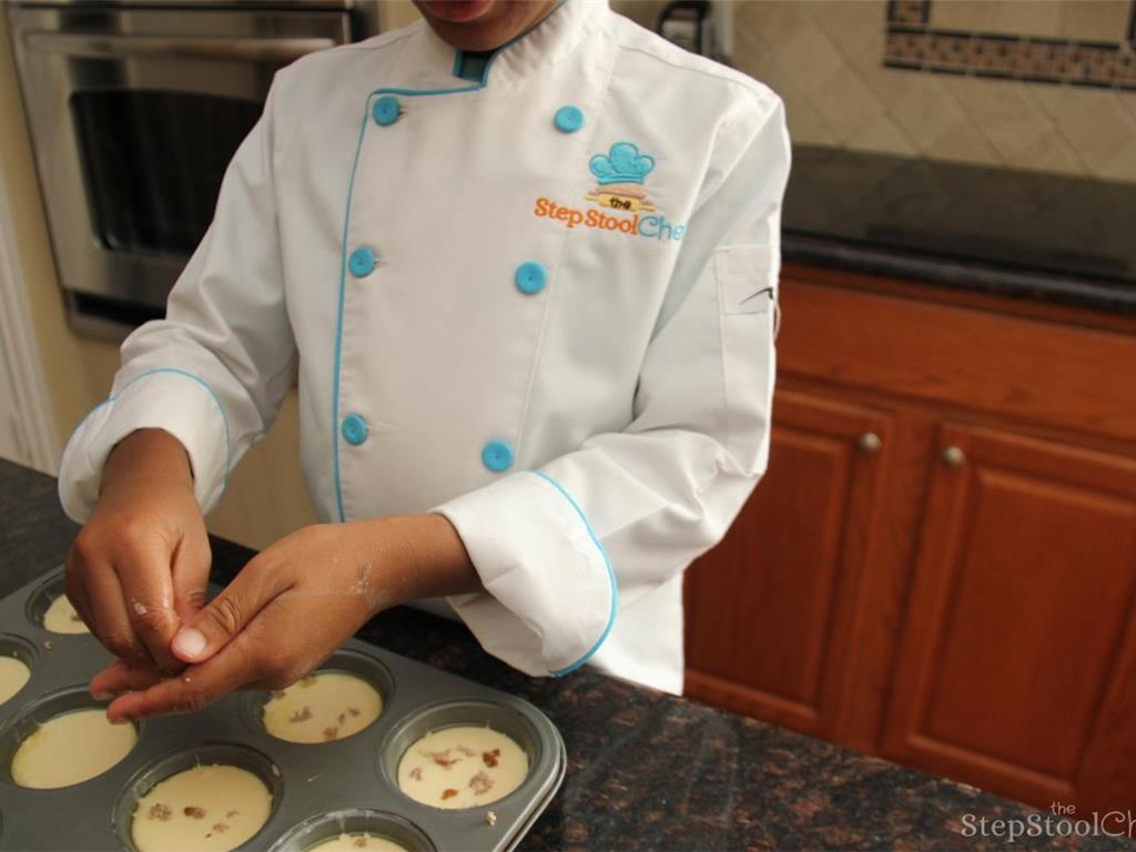 Step 3 of Turkey Sausage Popovers Recipe: Pour batter into the muffin pan and top with sausage then bake for 30-35 minutes until golden brown.