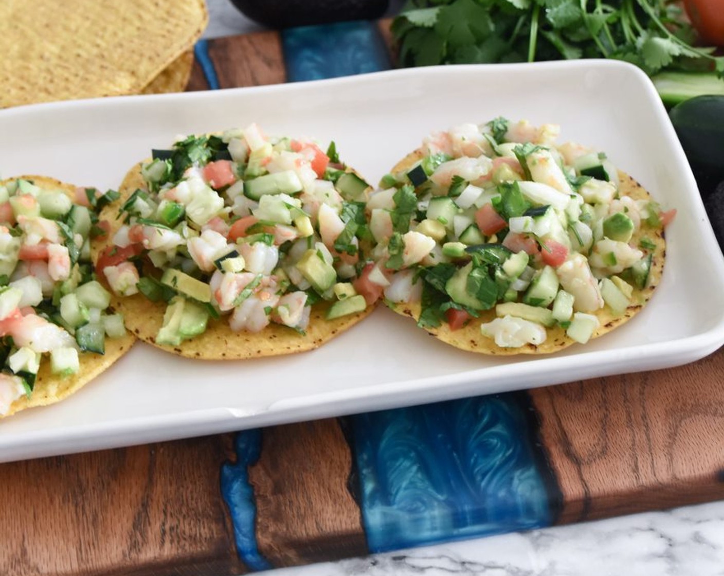 step 4 Scoop the shrimp mixture onto the Tostada Shells (6). Enjoy with your family!