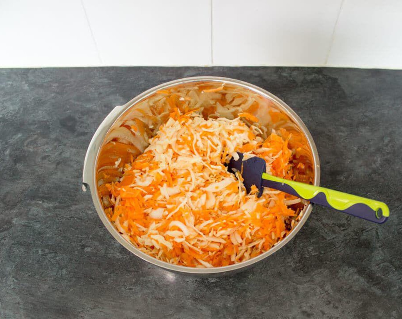 step 3 Tip the grated vegetables into a large bowl.