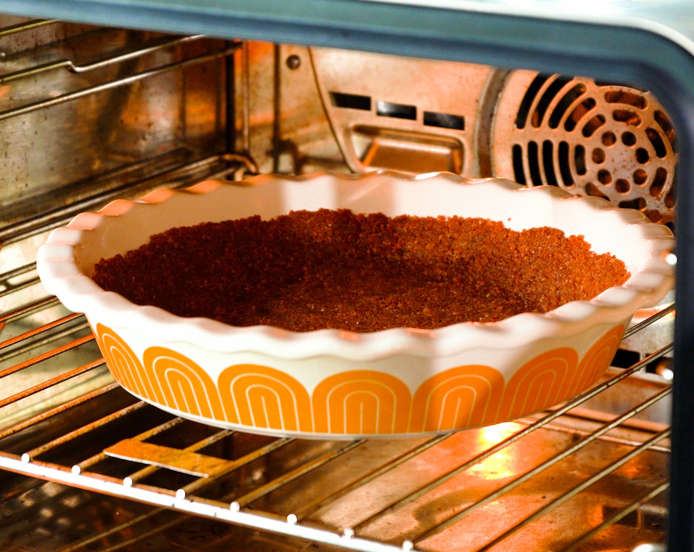 step 2 Press the mixture evenly into a 9-inch pie pan. Bake the crust for 10-15 minutes or until golden brown.