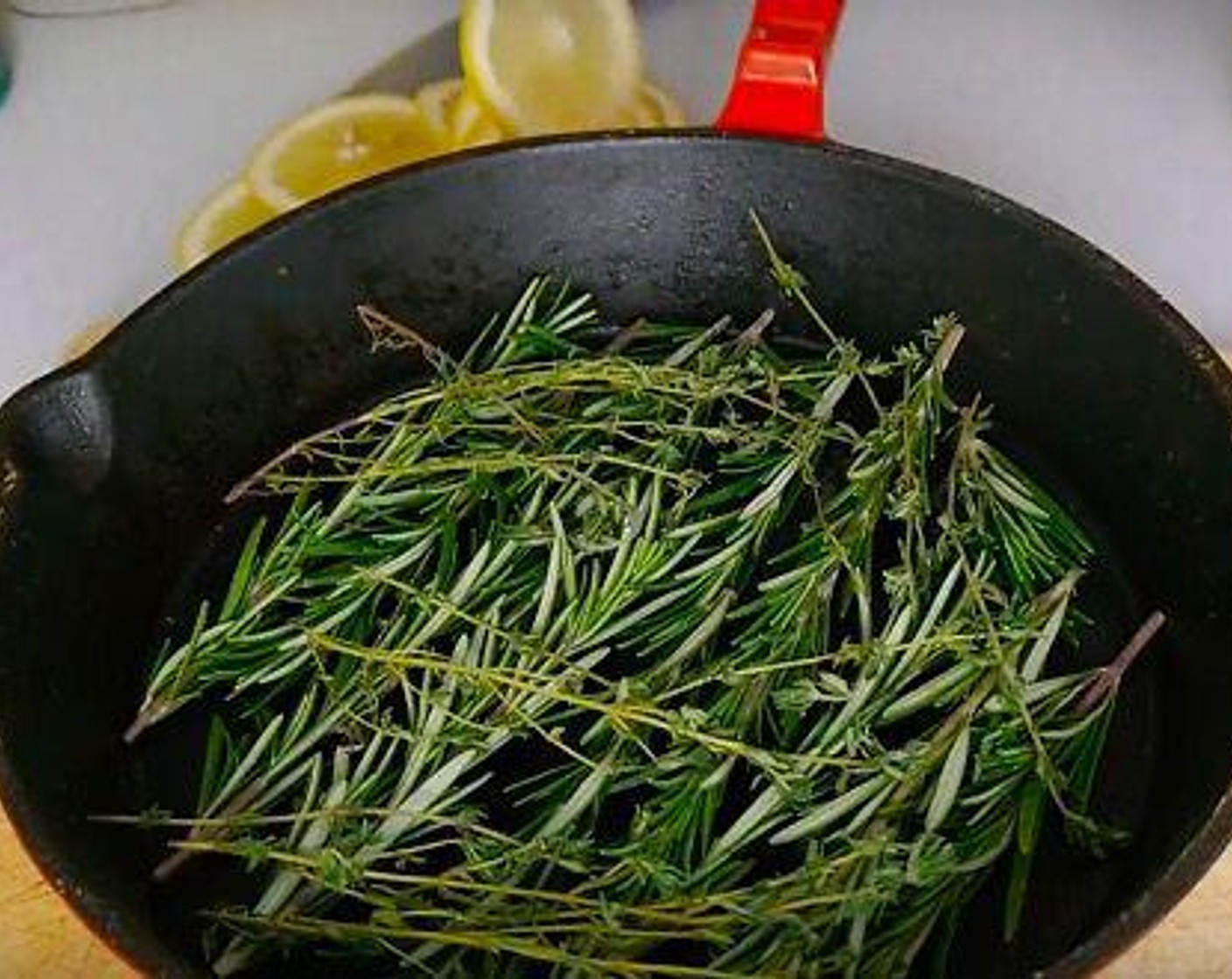 step 4 In an oven-safe skillet or baking tray make a bed of Fresh Rosemary (1/2 cup) and Fresh Thyme (1/3 cup).