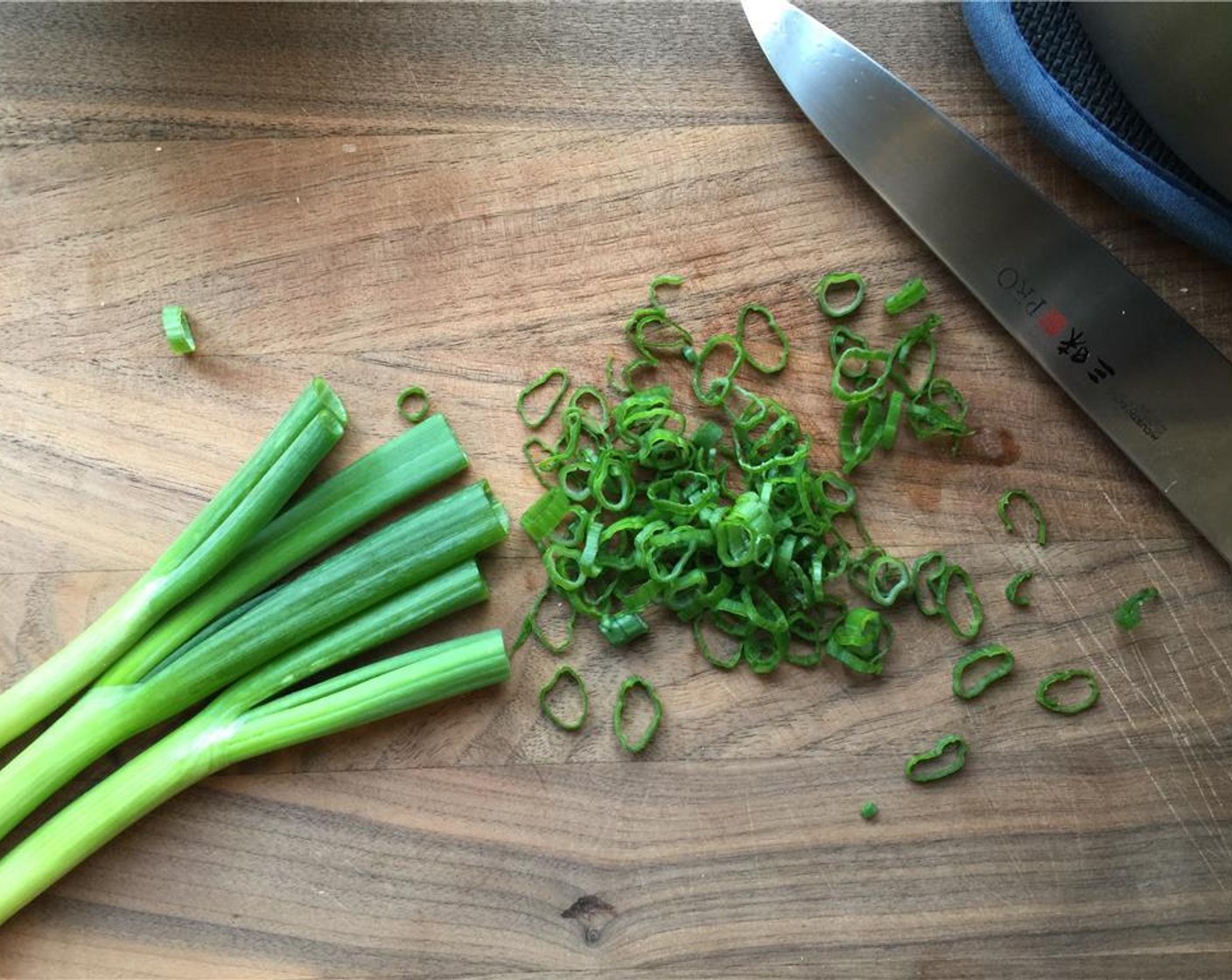 step 11 Thinly slice the green tops of the Scallion (1 bunch) and set aside.