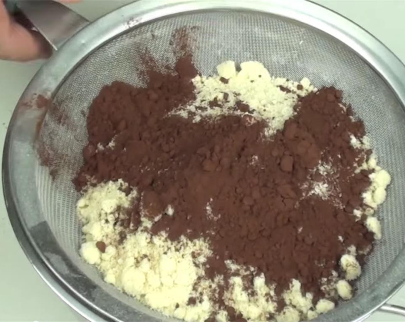 step 2 Sift together Powdered Confectioners Sugar (1 3/4 cups), Almond Meal (1 cup), and Dark Cocoa Powder (2 Tbsp) in a large bowl. Stir to combine.