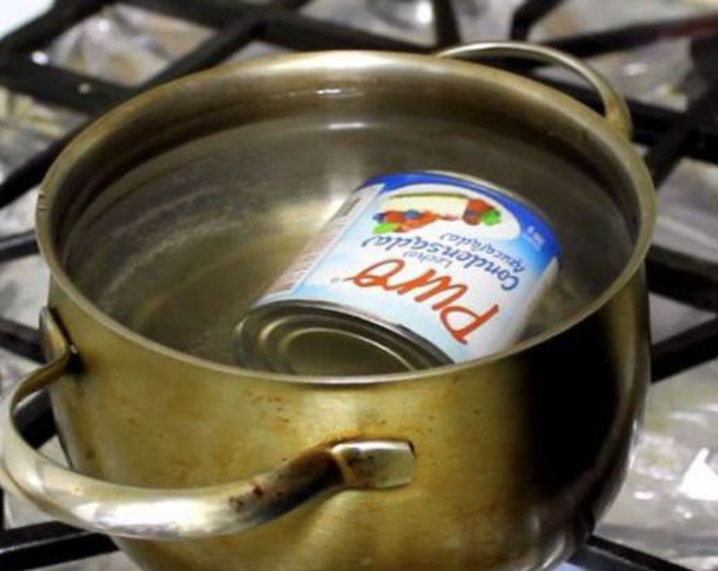 step 1 To make dulce de leche, place La Lechera® Sweetened Condensed Milk (1 1/3 cups) in a saucepan and cover with water.