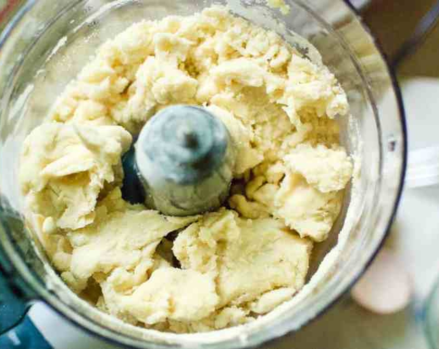 step 2 Combine the Farmhouse Eggs® Large Brown Egg (1) and Water (1/2 cup) in a small bowl. Add to the food processor and pulse until the mixture just begins to clump together.