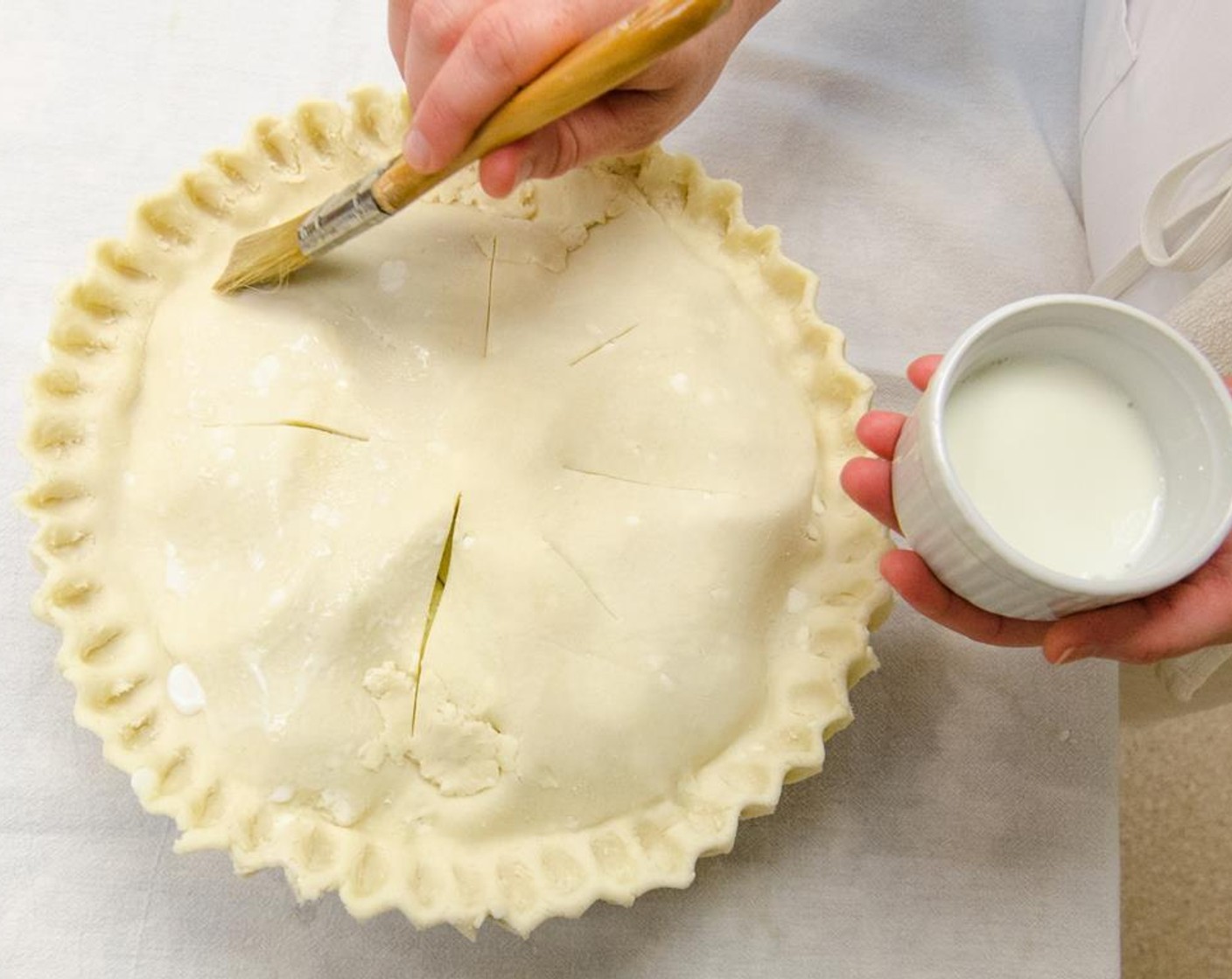 step 25 Brush the top crust lightly with the Eggland's Best Classic Egg (1) white or milk.