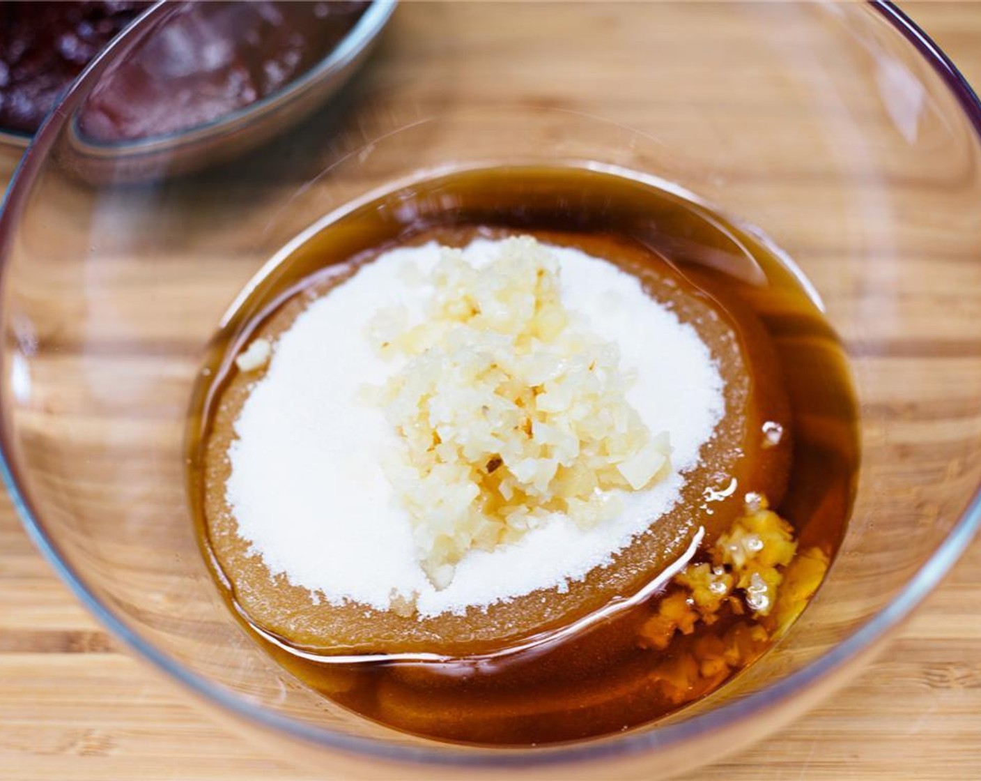 step 2 Combine Sesame Oil (1 cup), Granulated Sugar (1 cup), and Garlic (1/4 clove) in a large bowl.