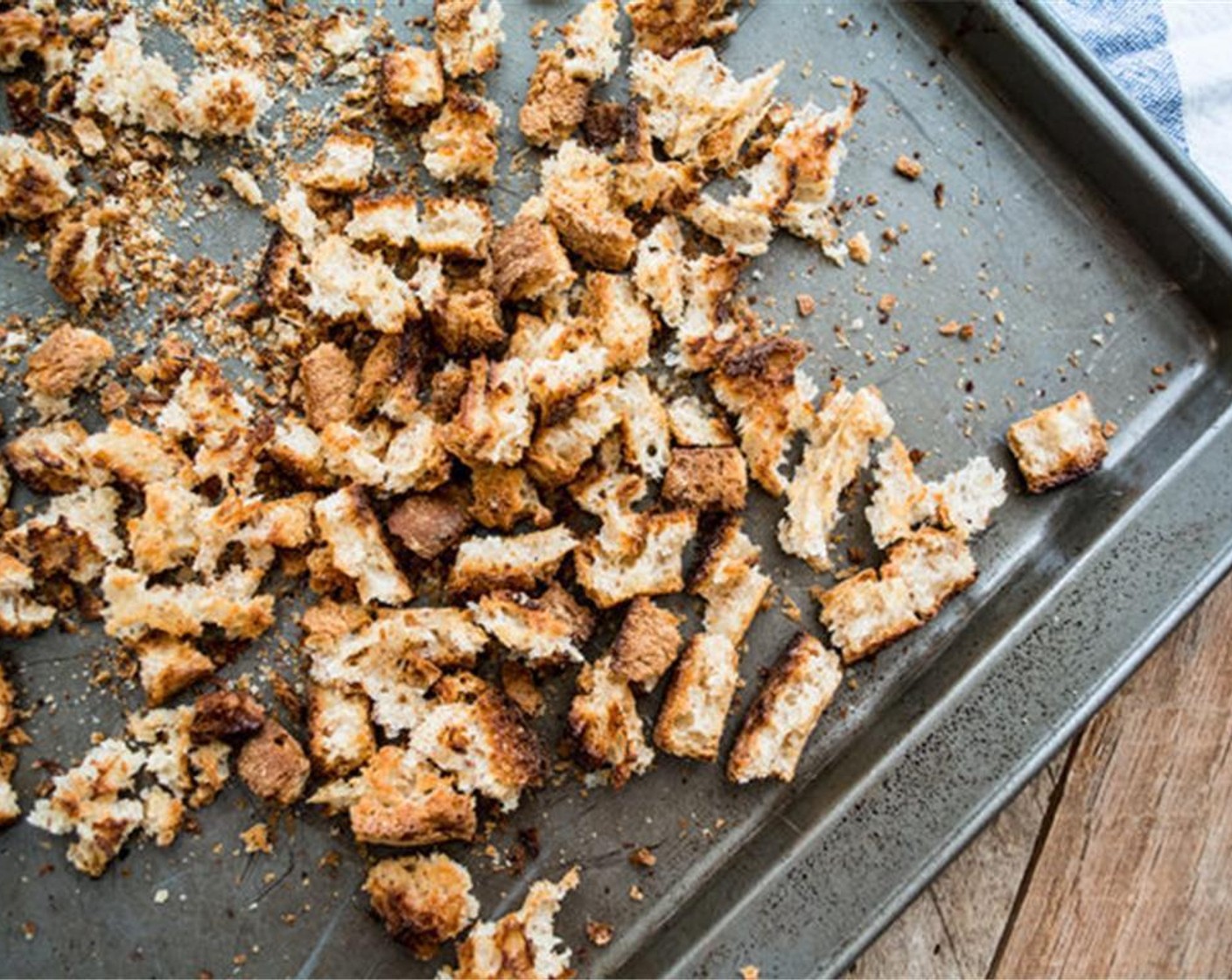 step 3 Once cooled, use hands to break the bread to create small crumbs. While the bread is still on the baking sheet, add Dried Parsley (1 tsp), Dried Basil (1 tsp), McCormick® Garlic Powder (1/4 tsp), Onion Powder (1/4 tsp), Dried Thyme (1/4 tsp) and toss. Set aside.